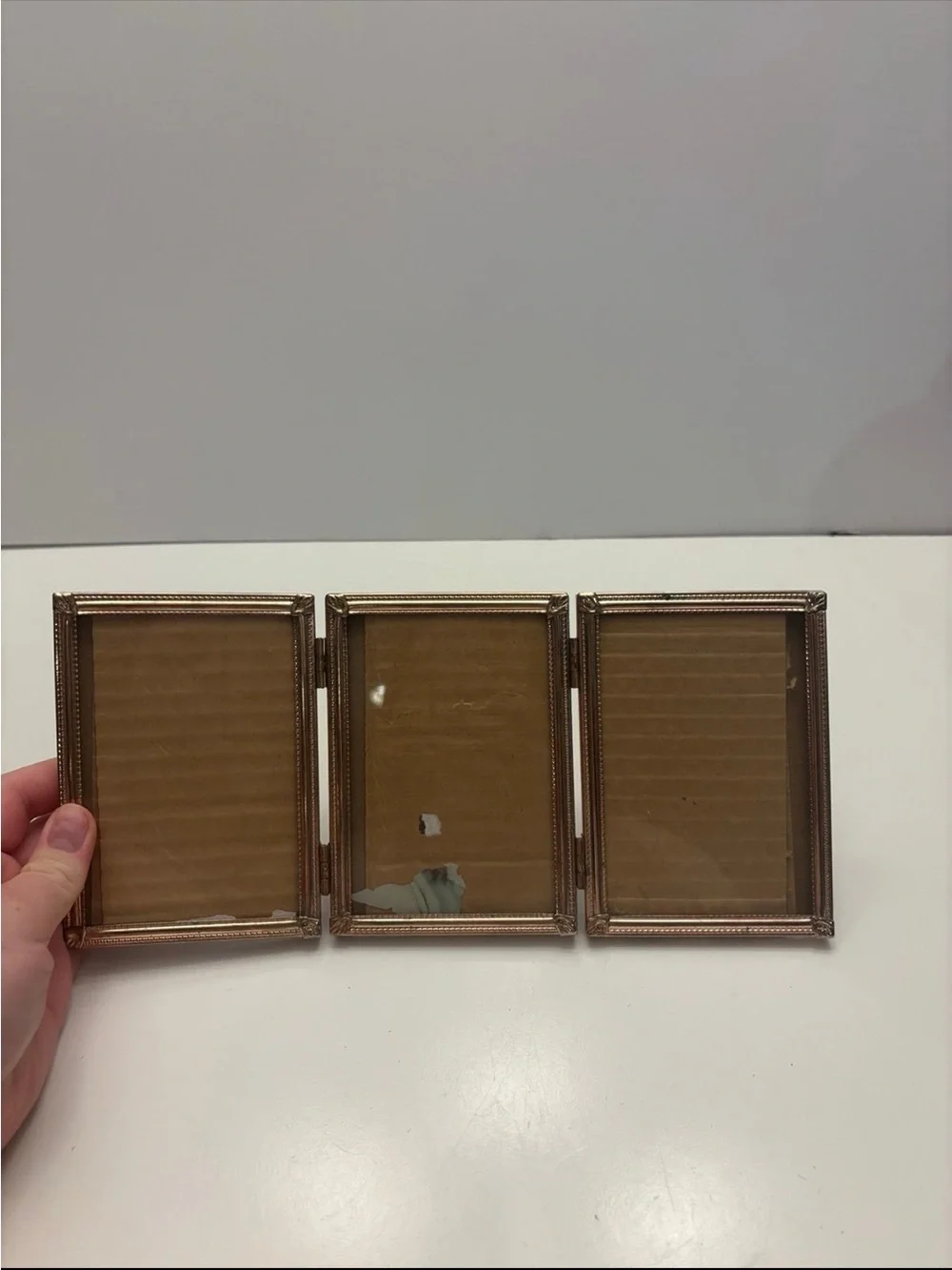 Vintage ornate golden color tri fold picture frame